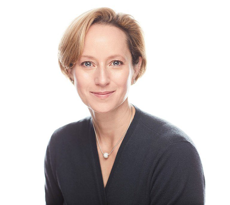 Woman With Short Hair And Gray Shirt